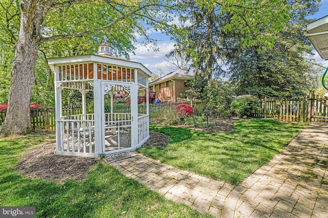 view of yard with a gazebo and a fenced backyard