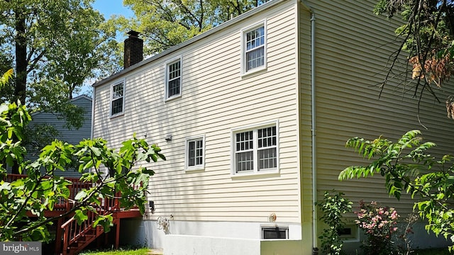 view of side of property with a chimney
