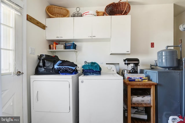 1306 Bayshore Ave, Brigantine, NJ 08203 - laundry room with plenty of natural light, washer and clothes dryer, and cabinet space