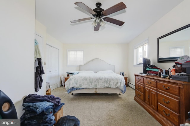 1306 Bayshore Ave, Brigantine, NJ 08203 - bedroom with light colored carpet, baseboard heating, and multiple windows