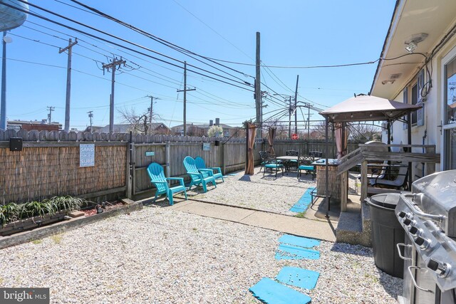 1306 Bayshore Ave, Brigantine, NJ 08203 - view of patio / terrace with area for grilling, a gazebo, and a fenced backyard