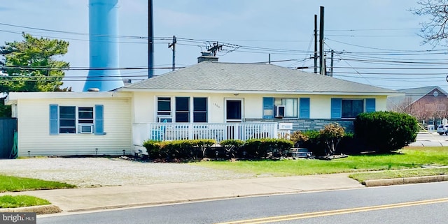1306 Bayshore Ave, Brigantine, NJ 08203 - view of front facade featuring covered porch, driveway, and stucco siding