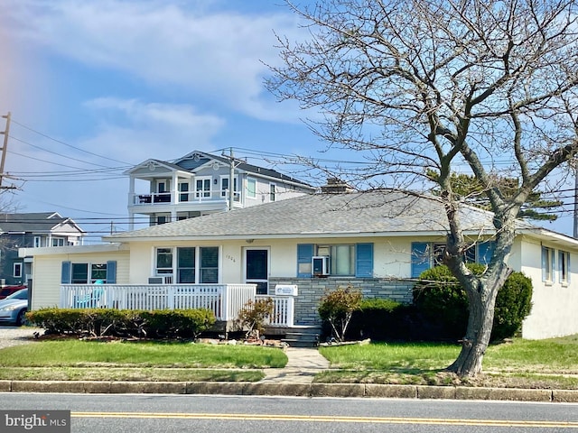 1306 Bayshore Ave, Brigantine, NJ 08203 - view of front of property featuring a shingled roof and stucco siding