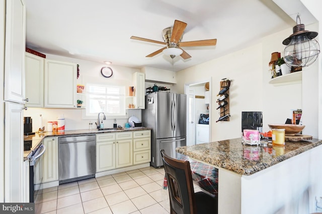 1306 Bayshore Ave, Brigantine, NJ 08203 - kitchen with open shelves, ceiling fan, a sink, appliances with stainless steel finishes, and light tile patterned floors