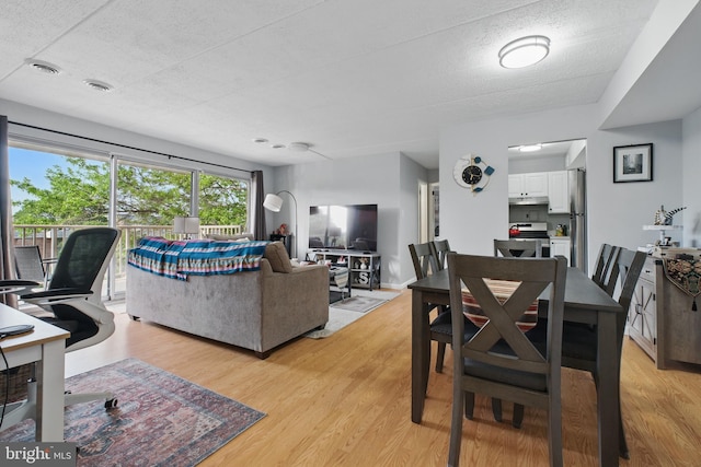 dining room with light wood-style floors