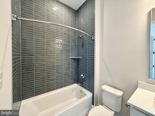 bathroom featuring vanity, washtub / shower combination, and toilet