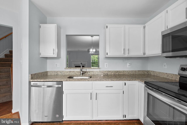 2204 Commissary Cir, Odenton, MD 21113 - kitchen featuring stainless steel appliances, a sink, and white cabinets