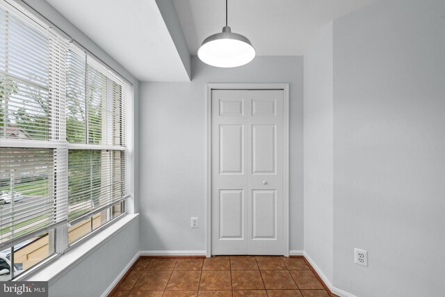 2204 Commissary Cir, Odenton, MD 21113 - empty room featuring dark tile patterned floors and baseboards