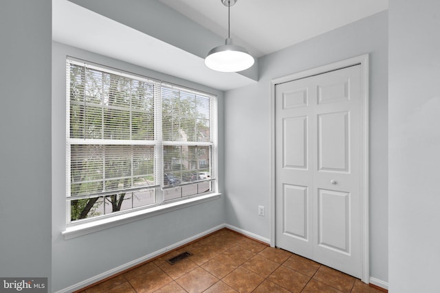 2204 Commissary Cir, Odenton, MD 21113 - unfurnished dining area featuring healthy amount of natural light, baseboards, and tile patterned floors