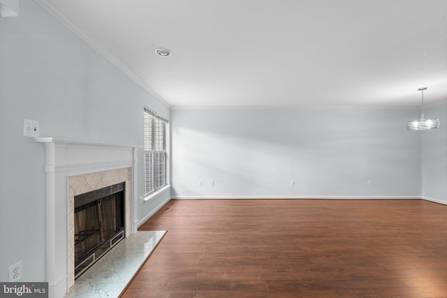 2204 Commissary Cir, Odenton, MD 21113 - unfurnished living room with crown molding, a fireplace, wood finished floors, and baseboards