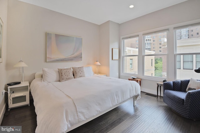 1516 16th Ct N, Arlington, VA 22209 - bedroom featuring baseboards, dark wood-type flooring, and recessed lighting
