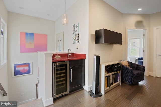1516 16th Ct N, Arlington, VA 22209 - indoor wet bar featuring beverage cooler, wood finished floors, baseboards, hanging light fixtures, and recessed lighting