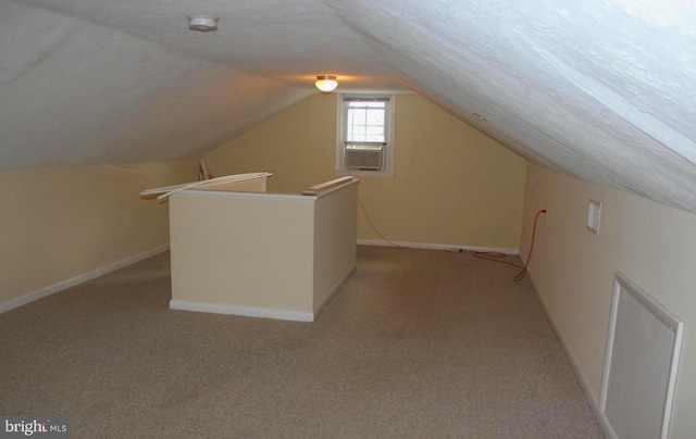 128 Fox Dr, Winchester, VA 22601 - additional living space featuring light colored carpet, vaulted ceiling, baseboards, and cooling unit