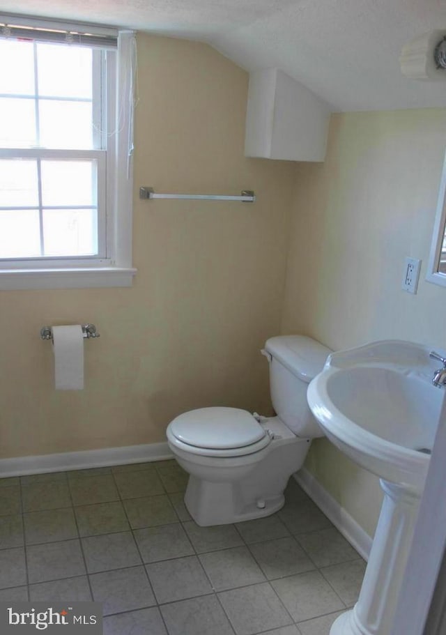 128 Fox Dr, Winchester, VA 22601 - bathroom featuring tile patterned flooring, toilet, baseboards, and a textured ceiling