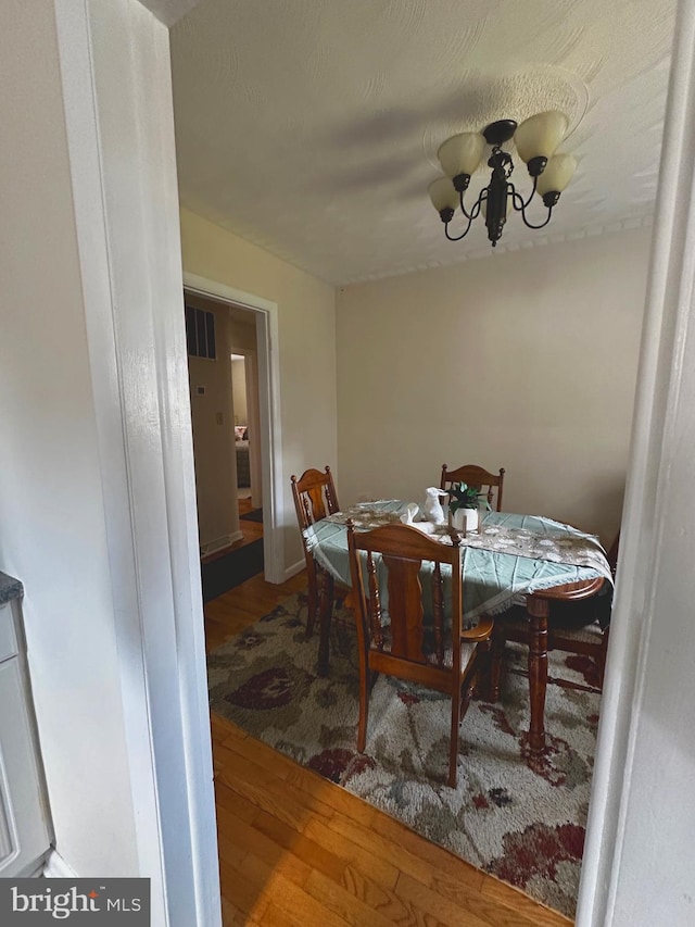 128 Fox Dr, Winchester, VA 22601 - dining area featuring wood finished floors and a chandelier