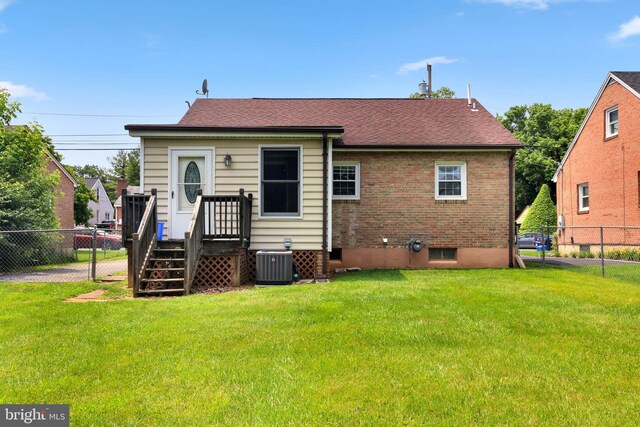 128 Fox Dr, Winchester, VA 22601 - rear view of house with central AC unit, roof with shingles, and brick siding