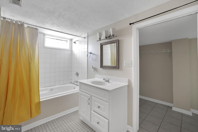 128 Fox Dr, Winchester, VA 22601 - full bath with shower / tub combo, vanity, tile patterned flooring, a textured ceiling, and baseboards