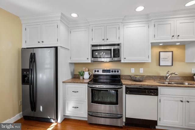 513 Princess Anne St, Fredericksburg, VA 22401 - kitchen with a sink, white cabinets, and stainless steel appliances