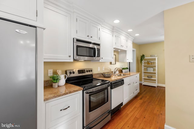 513 Princess Anne St, Fredericksburg, VA 22401 - kitchen featuring white cabinets, stainless steel appliances, recessed lighting, and a sink