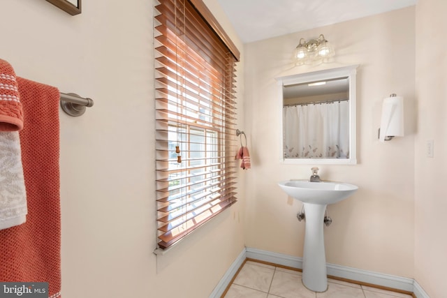 513 Princess Anne St, Fredericksburg, VA 22401 - bathroom featuring baseboards and tile patterned flooring