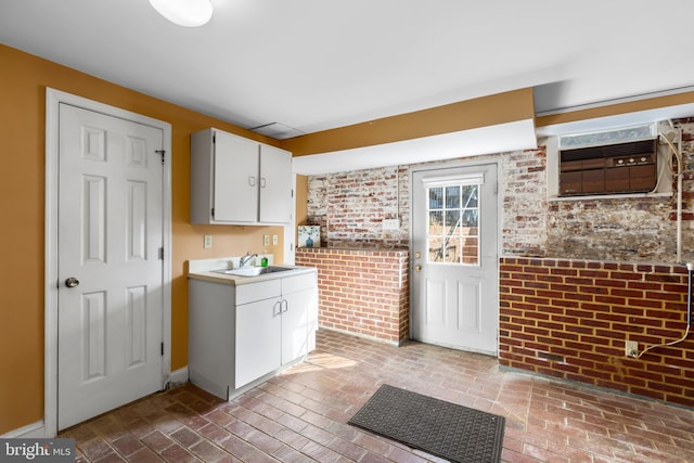 513 Princess Anne St, Fredericksburg, VA 22401 - laundry room with a sink, brick floor, and brick wall