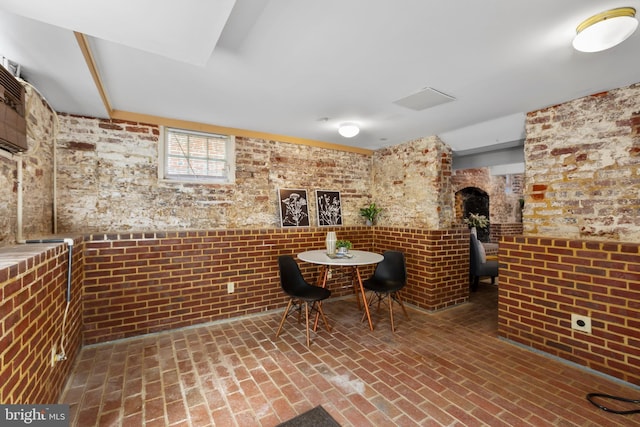 513 Princess Anne St, Fredericksburg, VA 22401 - interior space with a wood stove and brick floor