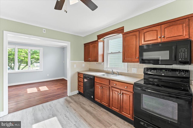 37 Louise Rd, New Castle, DE 19720 - kitchen with black appliances, a sink, ceiling fan, light countertops, and tasteful backsplash