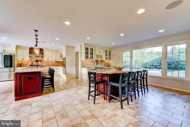 dining space featuring recessed lighting, light tile patterned floors, and baseboards