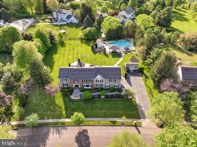 view of subject property featuring a pool area