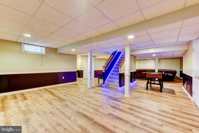 rec room featuring a drop ceiling, wood finished floors, recessed lighting, and baseboards