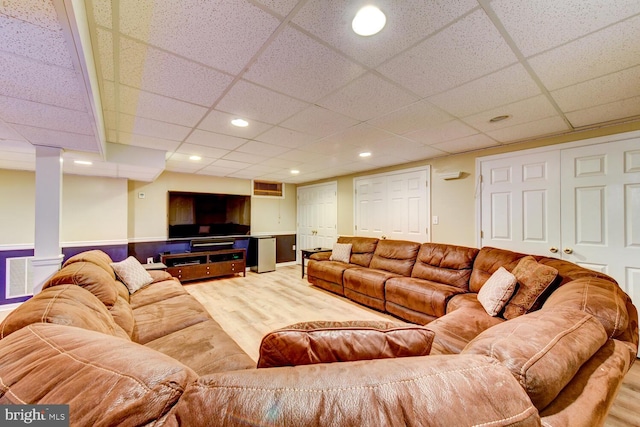 living room featuring wood finished floors, a paneled ceiling, and recessed lighting