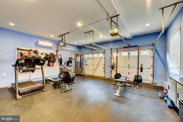 workout area with a garage and recessed lighting