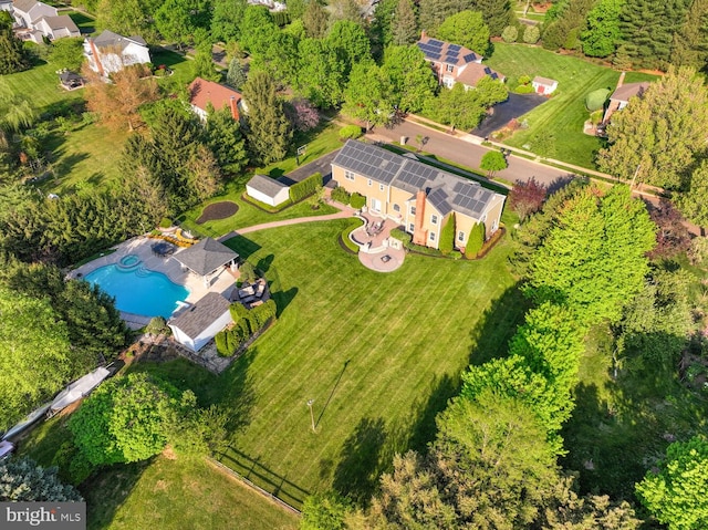 view of property location featuring a pool
