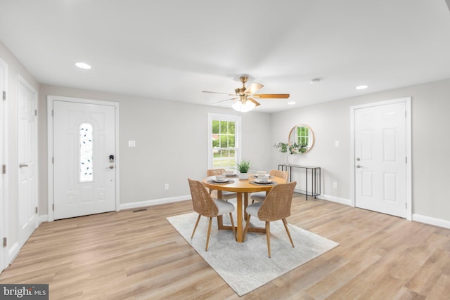 dining space featuring recessed lighting, a ceiling fan, baseboards, and light wood-style floors