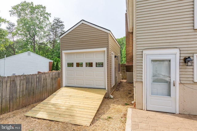 garage with fence