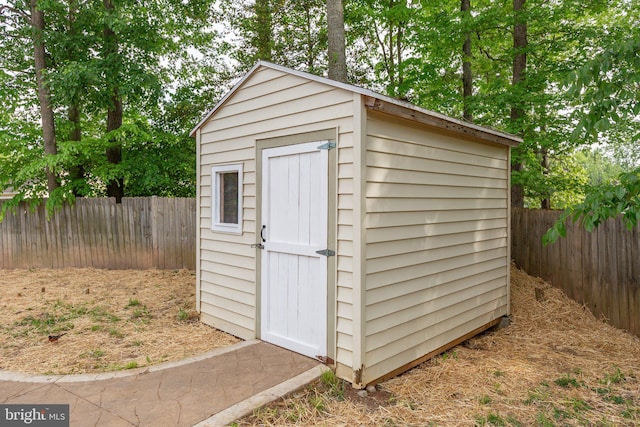 view of shed featuring a fenced backyard