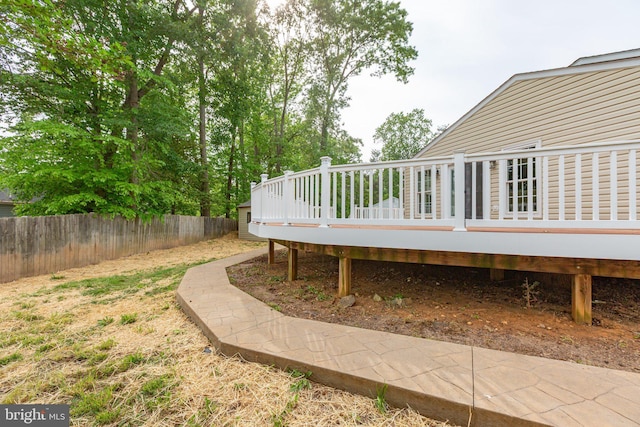 view of yard with fence and a wooden deck