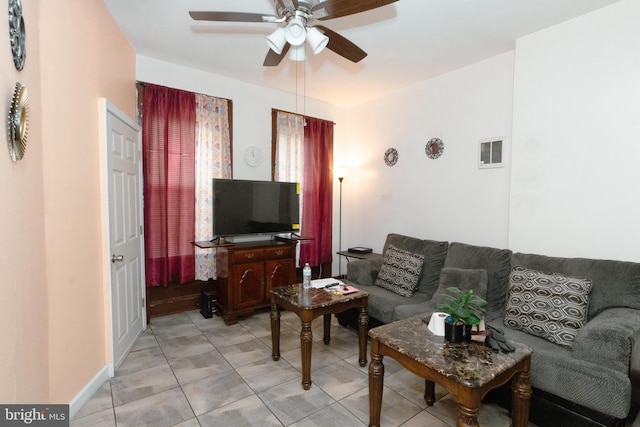 living room featuring a ceiling fan