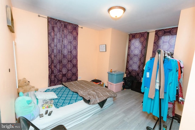 bedroom featuring wood finished floors