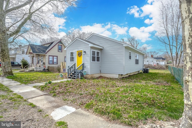 290 Garfield St, Carneys Point, NJ 08069 - bungalow-style home with fence, central AC unit, entry steps, and a front lawn