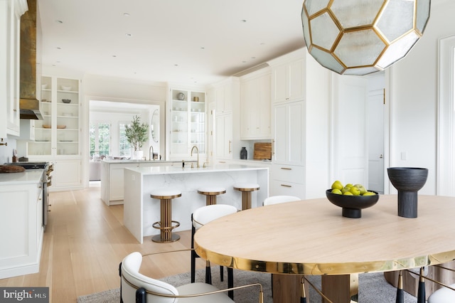 dining space with light wood-style flooring
