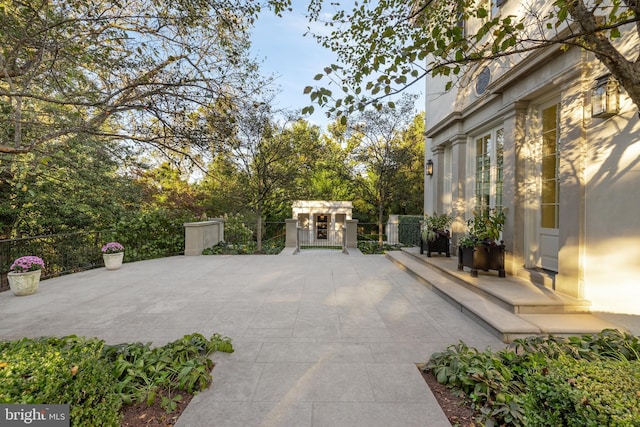 view of patio / terrace featuring a gate and fence