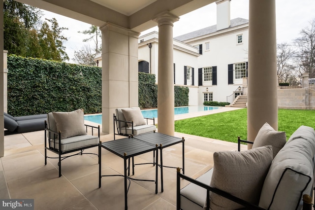 view of patio featuring a fenced in pool and fence