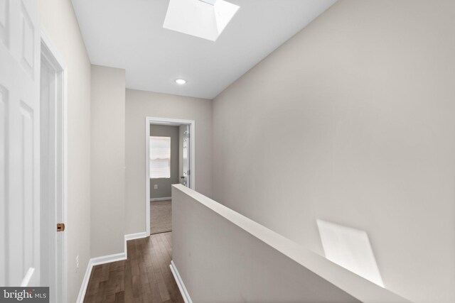 1414 N Bethel St, Baltimore, MD 21213 - hall with a skylight, baseboards, dark wood-style floors, an upstairs landing, and recessed lighting