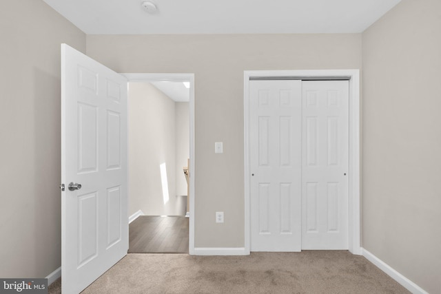 1414 N Bethel St, Baltimore, MD 21213 - unfurnished bedroom with carpet flooring, a closet, and baseboards