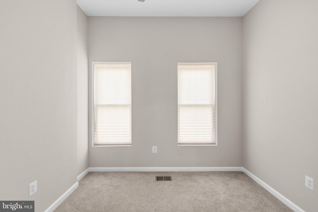 1414 N Bethel St, Baltimore, MD 21213 - carpeted empty room with baseboards and plenty of natural light