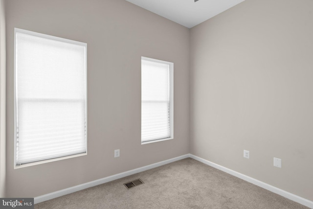 1414 N Bethel St, Baltimore, MD 21213 - spare room featuring carpet flooring and baseboards