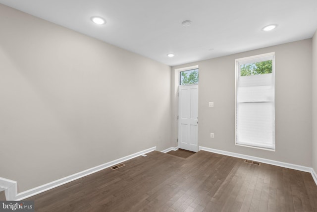 1414 N Bethel St, Baltimore, MD 21213 - unfurnished room with baseboards, dark wood-type flooring, and recessed lighting