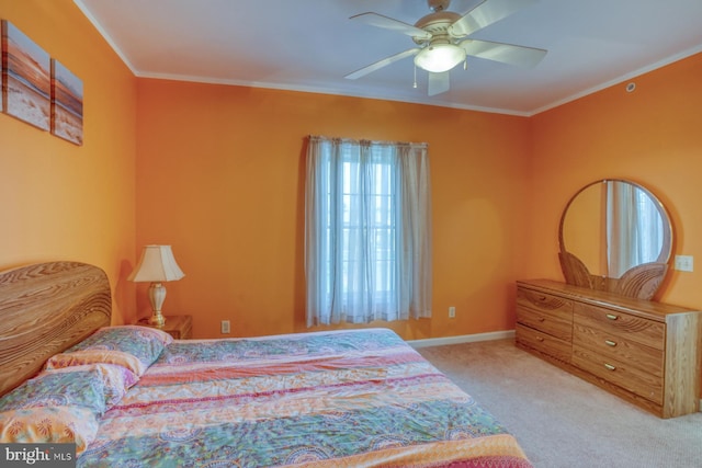 bedroom featuring ornamental molding, carpet, and ceiling fan