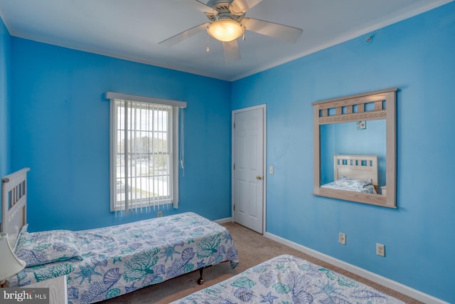 bedroom featuring baseboards, ceiling fan, and carpet